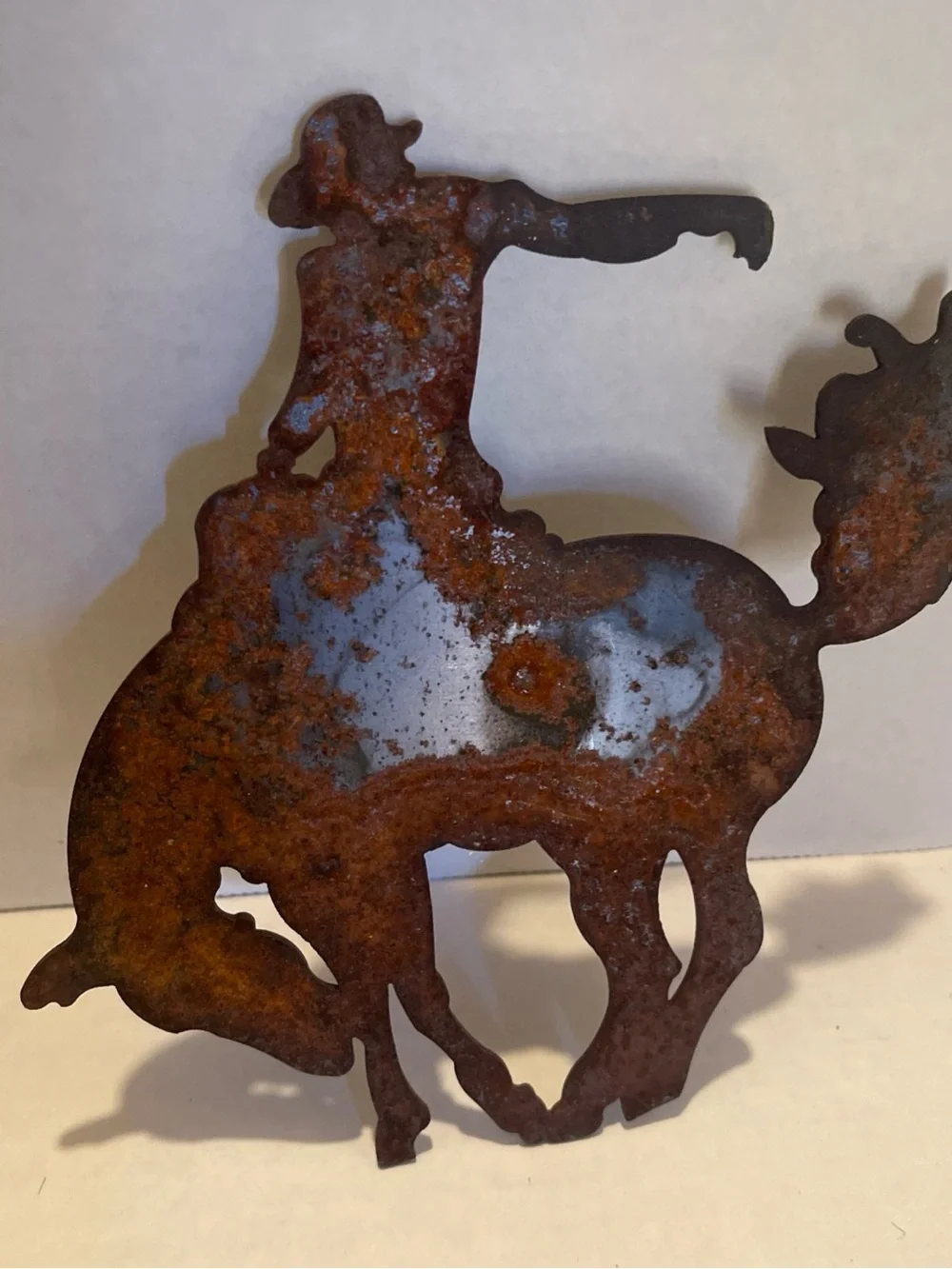 Vintage metal Rust Patina Cowboy Bucking Bronco